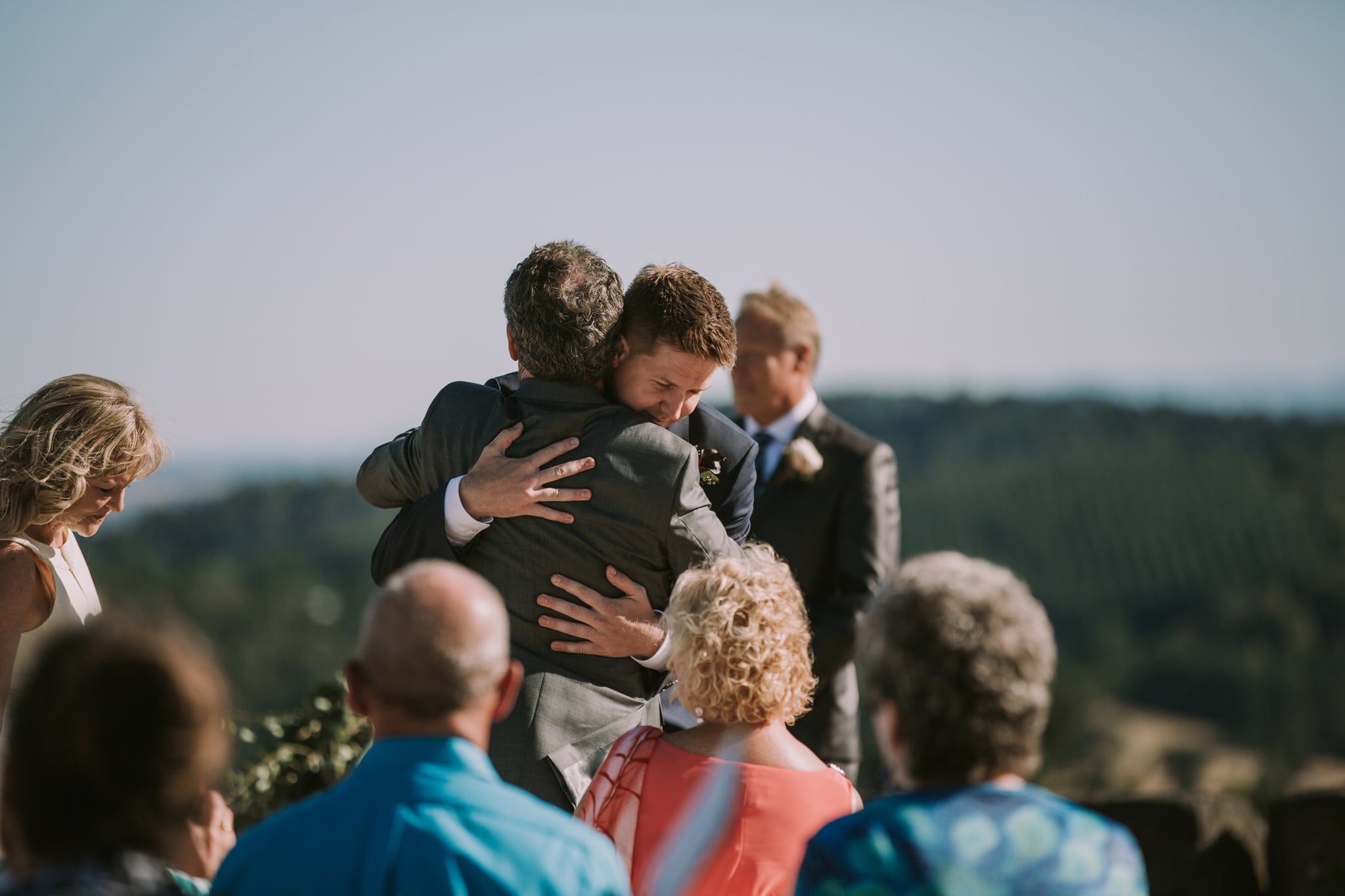 father groom hug Youngberg Hill Wedding Portland Wedding Photographer Marcela Pulido