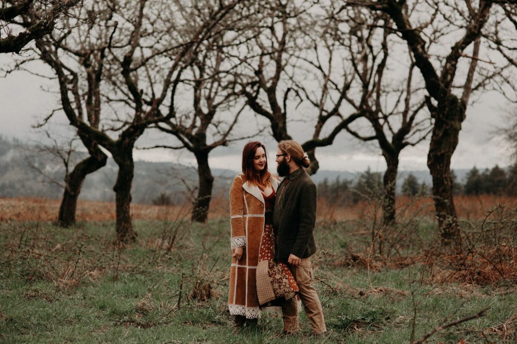 cute hippie couple in forest Powell Butte Portland Engagement Photographer by Marcela Pulido Photography Portland Wedding Photographer