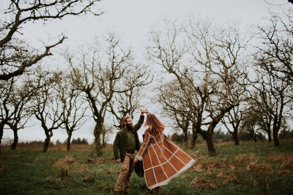 cute boho hippie couple dance in forest Powell Butte Portland Engagement Photographer by Marcela Pulido Photography Portland Wedding Photographer