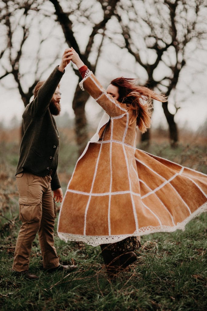 give her a spin! in the forest Powell Butte Portland Engagement Photographer by Marcela Pulido Photography Portland Wedding Photographer
