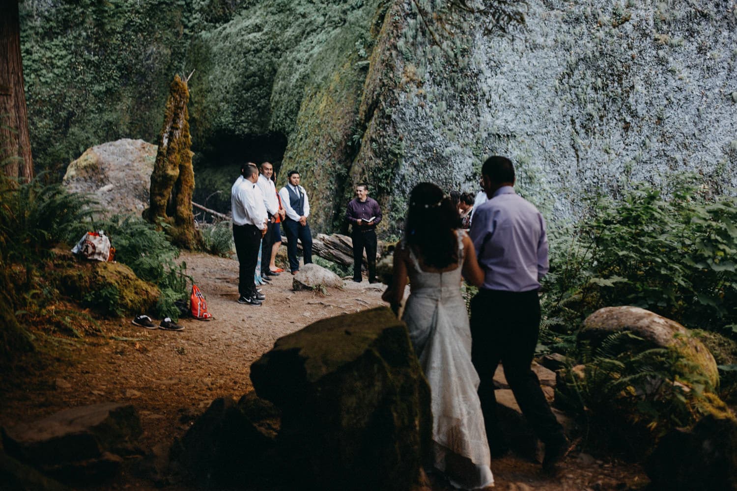 bride walking down aisle wahclella falls Oregon Columbia River Gorge elopement