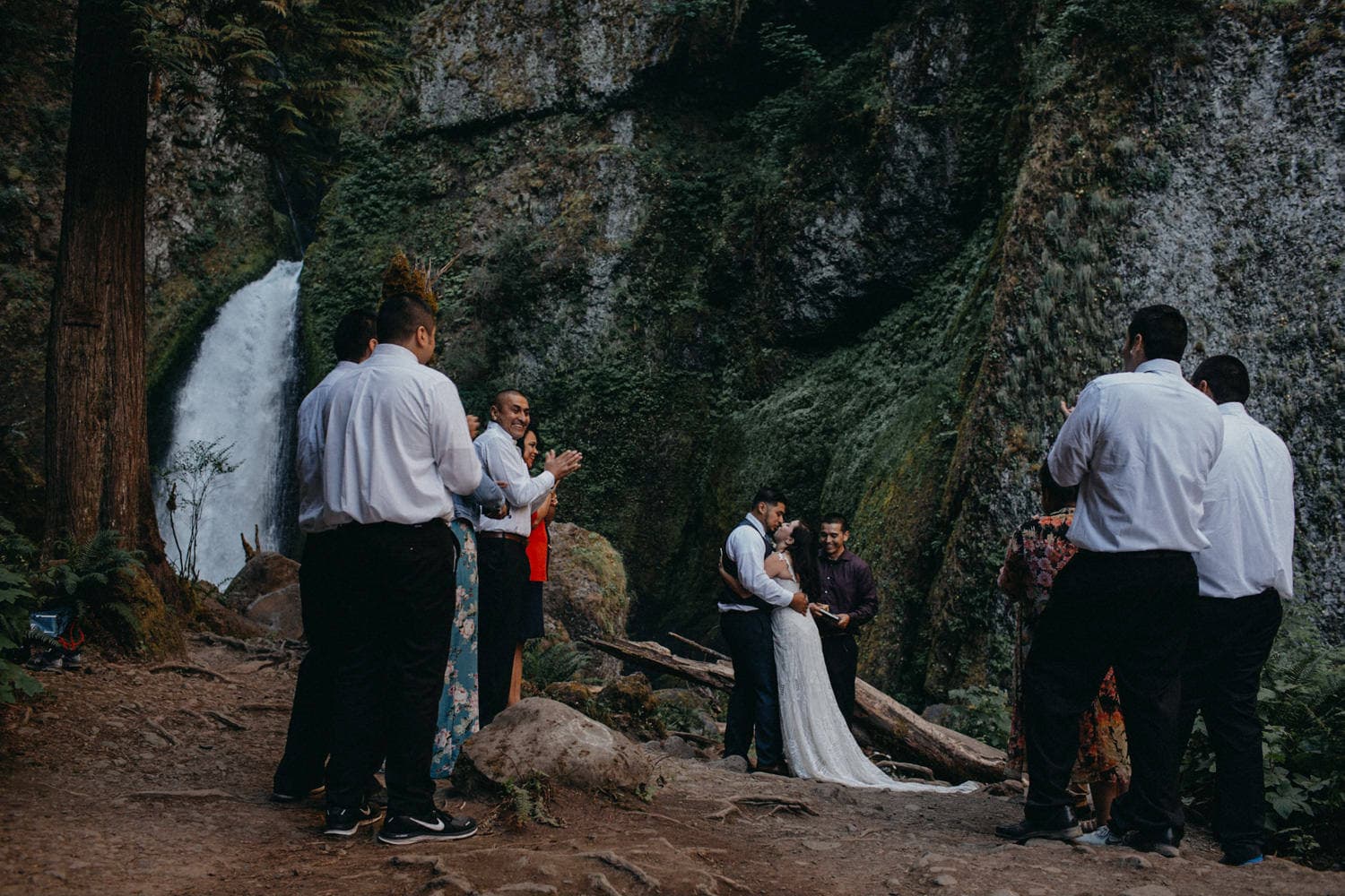 first kiss as newlyweds at Wahclella Falls Oregon Columbia River Gorge elopement