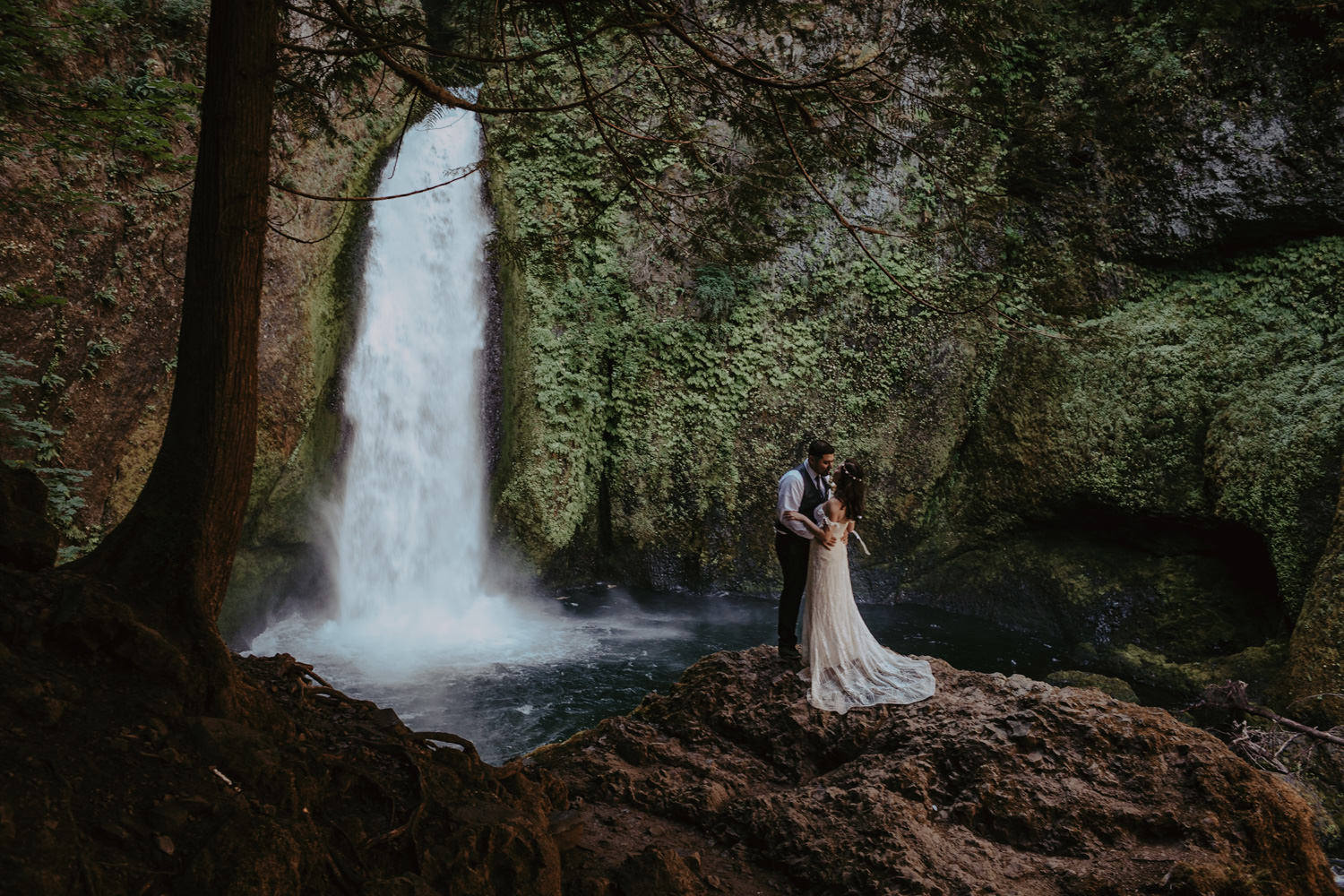 newlyweds in front of Wahclella Falls Columbia River Gorge elopement