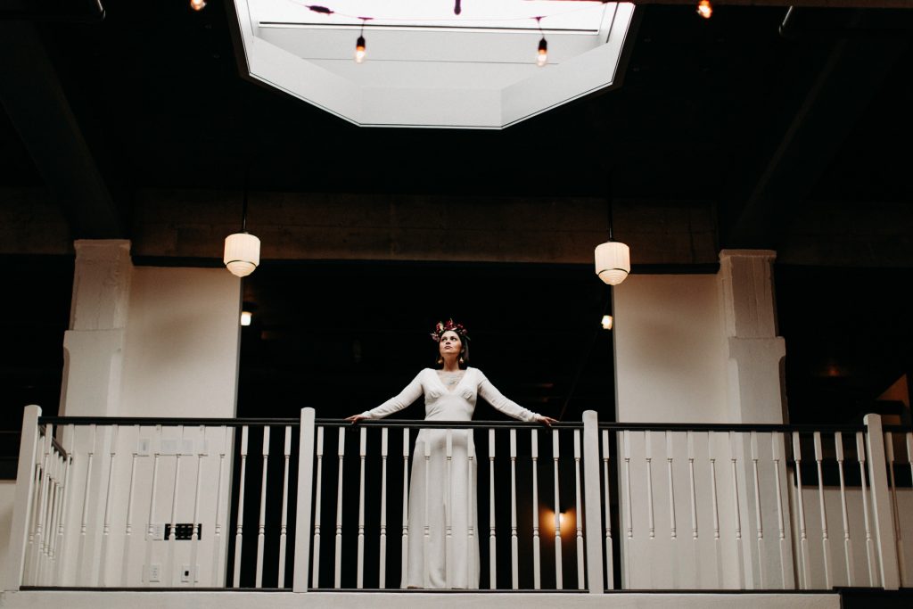 gorgeous latina bride looking down at the evergreen pdx wedding venue