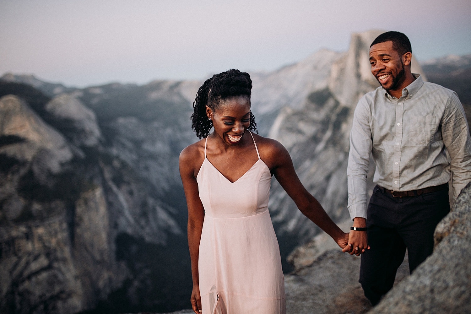 what to wear for your engagement photos black couple wearing pastel colors in yosemite national park