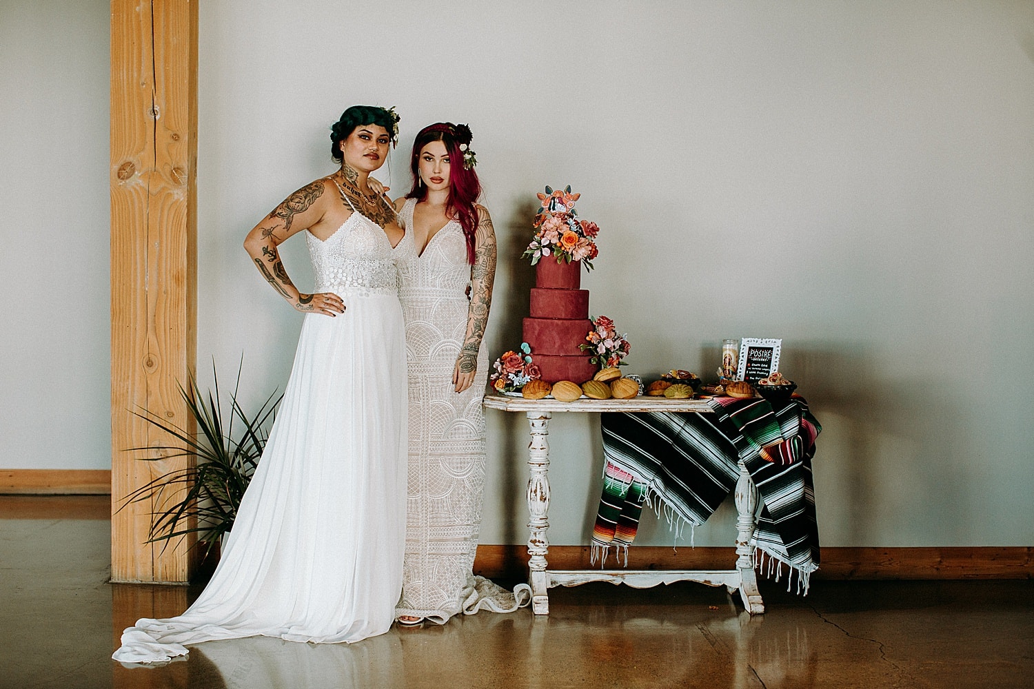 edgy stunning green and pink haired tattooed brides at their dessert table for hispanic style wedding photographed by Marcela Pulido Photographer Portland Wedding Photography