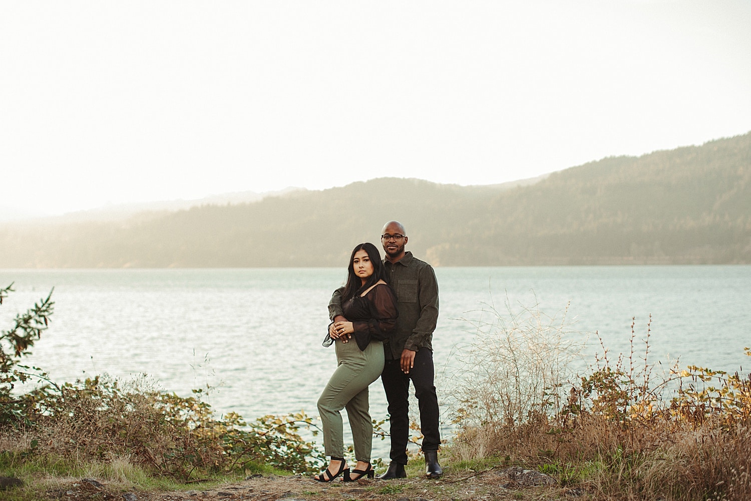 what to wear for your engagement photos featuring a latina woman and black man wearing a casual outfit out in the columbia river gorge