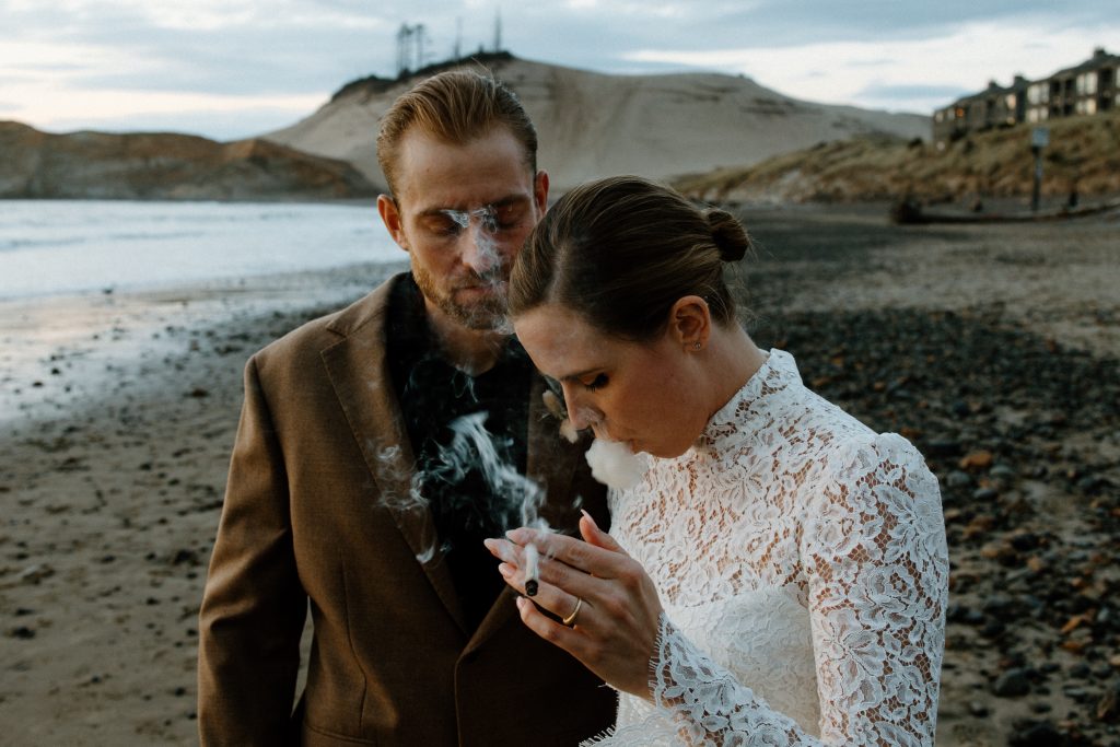 photography of fashionable and modern couple smoking a joint on the oregon coast captured by portland wedding photographer marcela pulido